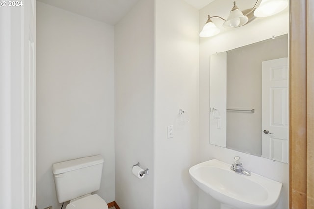 bathroom with toilet and sink