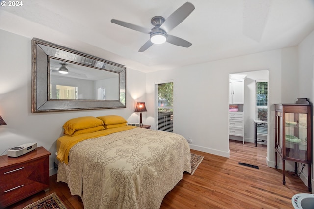 bedroom with wood-type flooring and ceiling fan