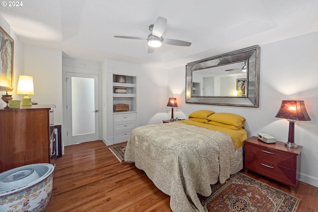 bedroom featuring ceiling fan and dark hardwood / wood-style flooring