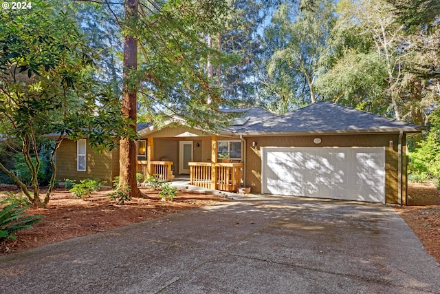 ranch-style house featuring a porch and a garage