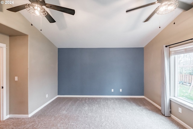 bonus room featuring ceiling fan, plenty of natural light, light colored carpet, and lofted ceiling