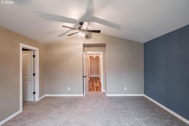 unfurnished bedroom with light colored carpet, ceiling fan, and lofted ceiling