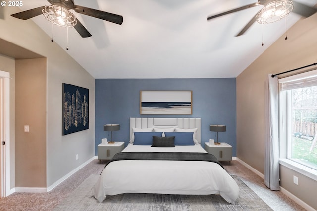 bedroom with light carpet, vaulted ceiling, and baseboards