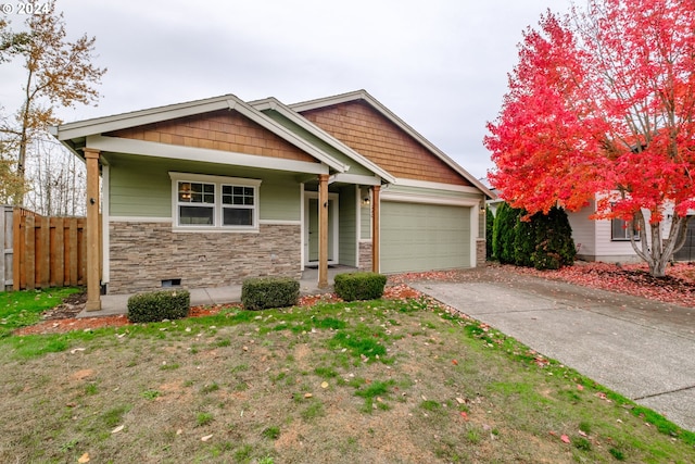 view of front of home featuring a porch and a garage