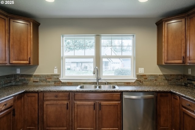 kitchen with dishwasher, brown cabinetry, a sink, and decorative backsplash