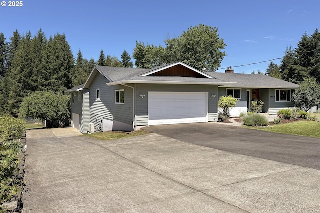 34603 SE Jarl Rd, Boring, OR 97009 - ranch-style home with concrete driveway, a garage, a chimney, and roof with shingles