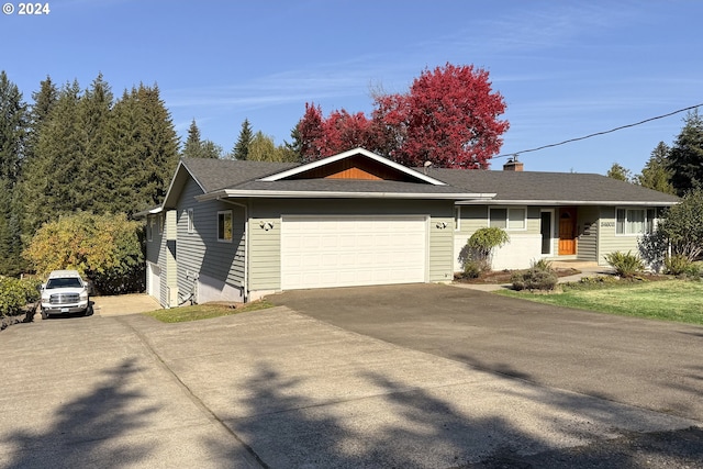 single story home with a garage