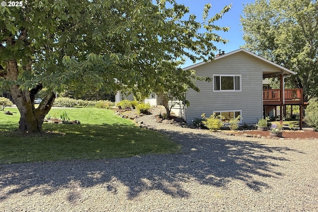 34603 SE Jarl Rd, Boring, OR 97009 - view of home's exterior featuring a lawn, a deck, and gravel driveway