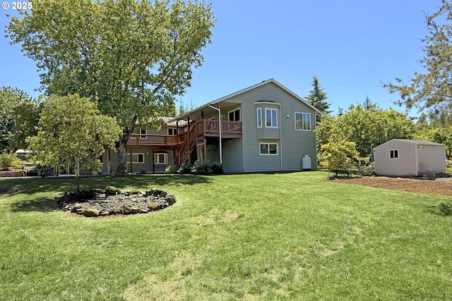 34603 SE Jarl Rd, Boring, OR 97009 - back of property with a lawn, a deck, and an outdoor structure