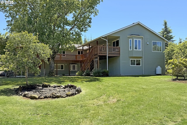 34603 SE Jarl Rd, Boring, OR 97009 - rear view of house with a wooden deck, stairway, and a yard