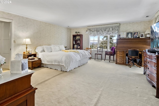 bedroom featuring light carpet and crown molding