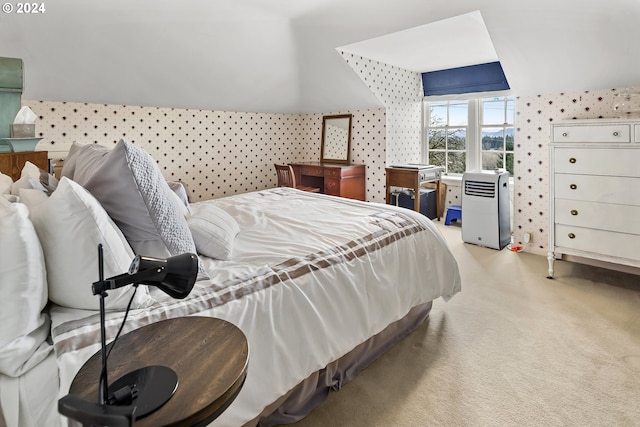 bedroom featuring light carpet and vaulted ceiling