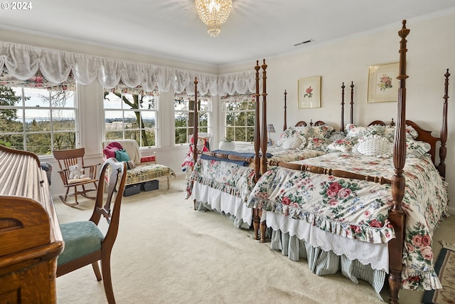 carpeted bedroom featuring crown molding and a notable chandelier