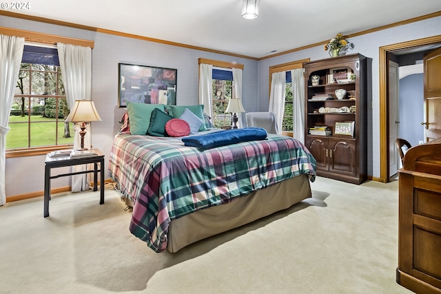 carpeted bedroom with ornamental molding