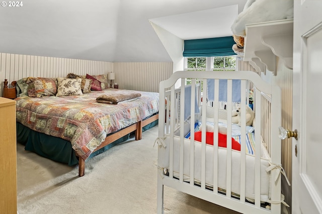 carpeted bedroom with vaulted ceiling