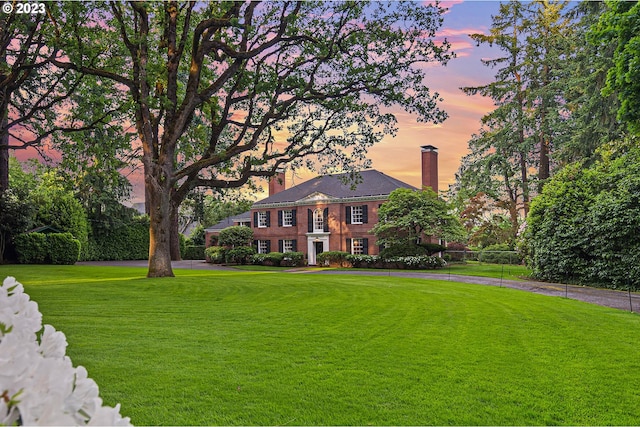 view of front of property with a yard