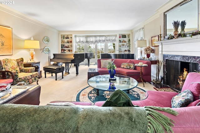 living room with built in shelves, light colored carpet, a high end fireplace, and crown molding