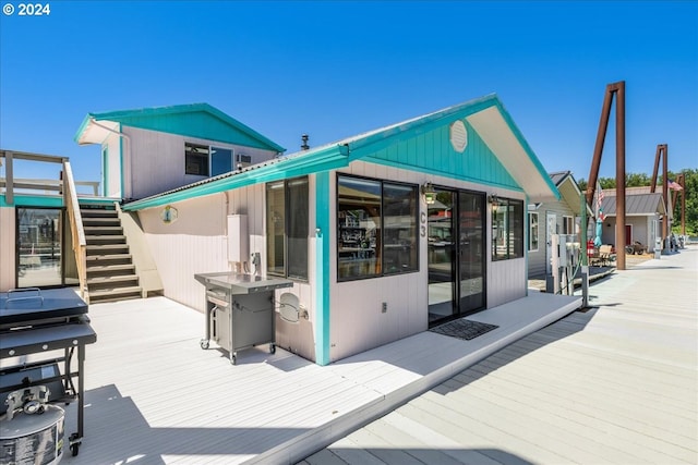 back of house with a sunroom