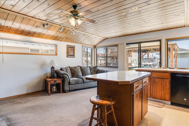 kitchen featuring a center island, light colored carpet, wood ceiling, and black dishwasher