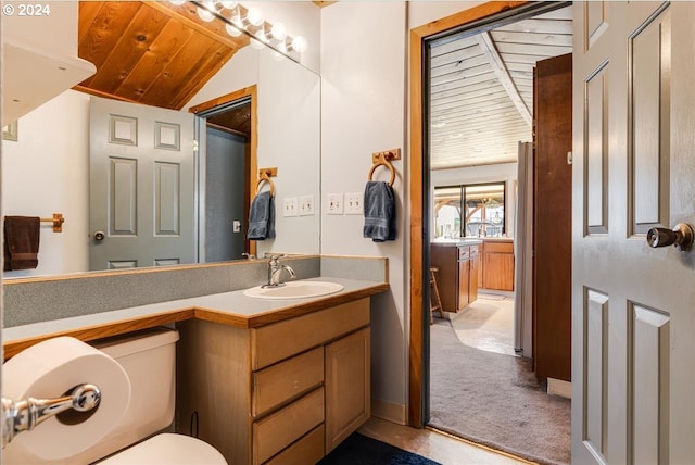 bathroom with lofted ceiling, toilet, wood ceiling, and vanity