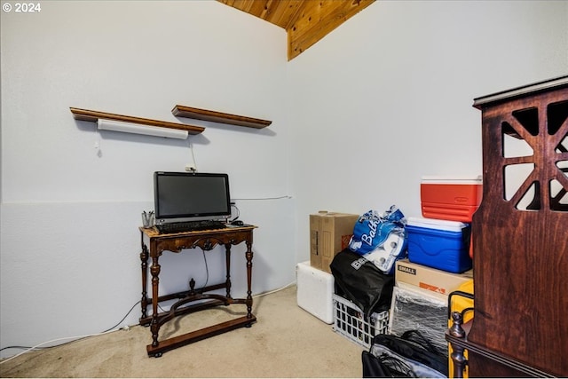 home office with carpet flooring and vaulted ceiling