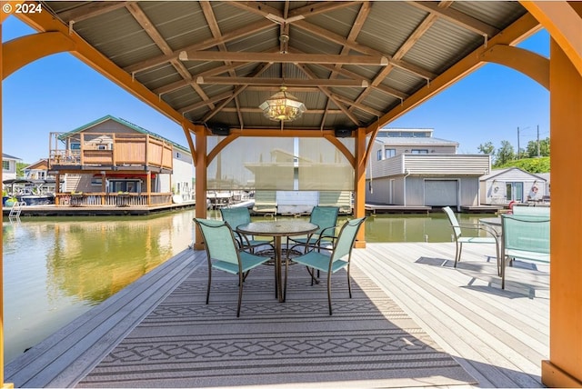 view of dock featuring a gazebo and a water view