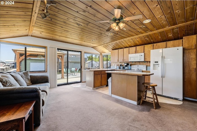 kitchen with white appliances, light colored carpet, vaulted ceiling, wooden ceiling, and a center island