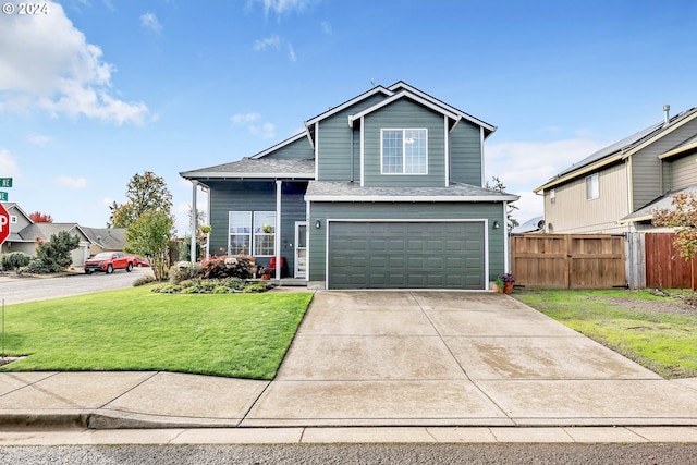 view of front property with a front yard and a garage