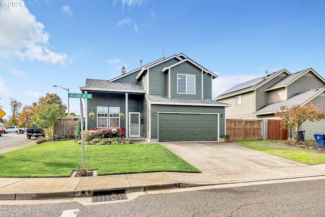 view of front of home with a garage and a front lawn