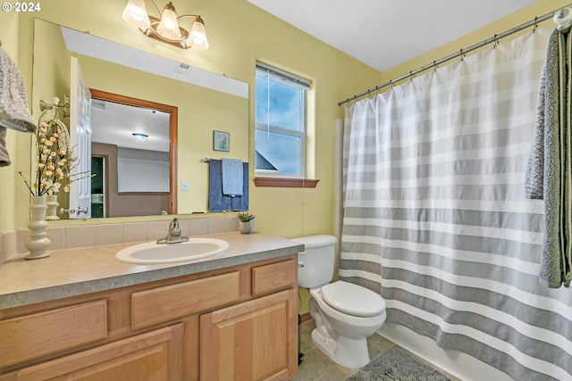 full bathroom featuring vanity, toilet, tile patterned floors, and shower / bath combination with curtain