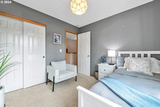 carpeted bedroom featuring a closet