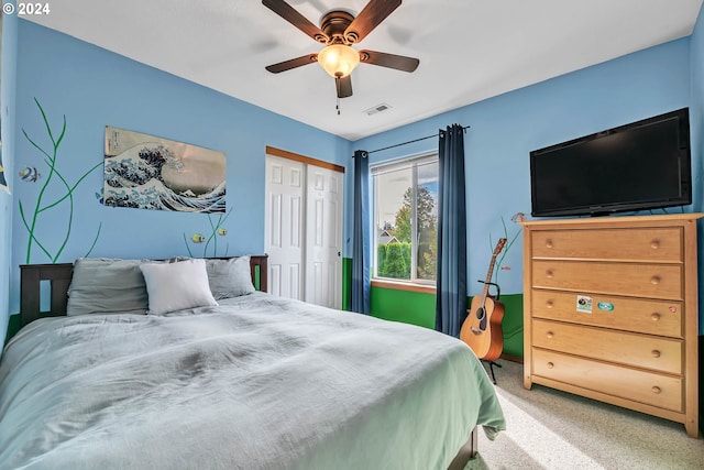 carpeted bedroom with ceiling fan