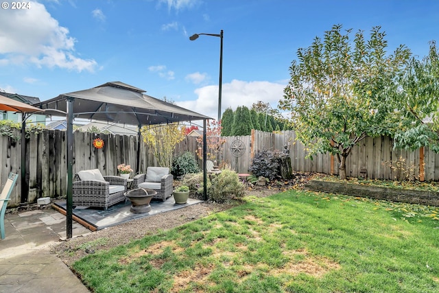 view of yard featuring a gazebo, a fenced backyard, and a patio