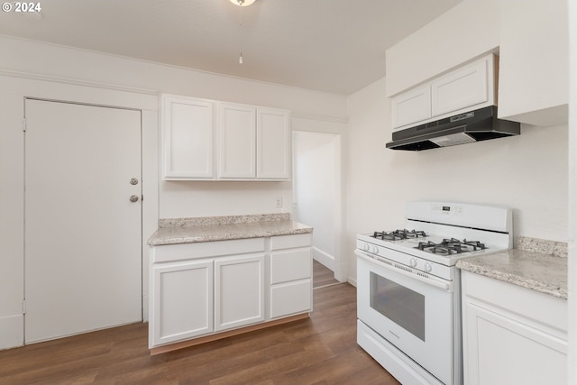 kitchen featuring dark hardwood / wood-style flooring, white cabinetry, light stone countertops, and white gas range oven