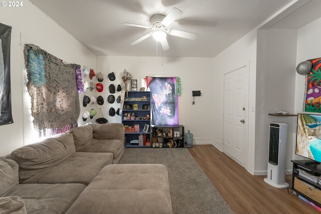 living room with ceiling fan and wood-type flooring