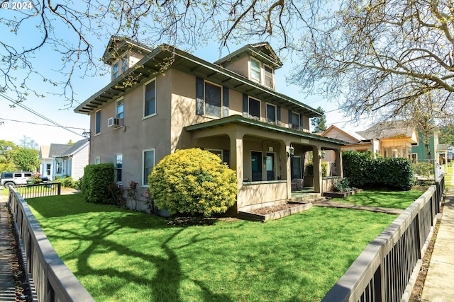 view of side of property with a porch and a lawn