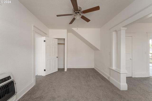 additional living space featuring carpet floors, ceiling fan, and heating unit