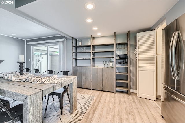 interior space featuring stainless steel refrigerator and light hardwood / wood-style floors