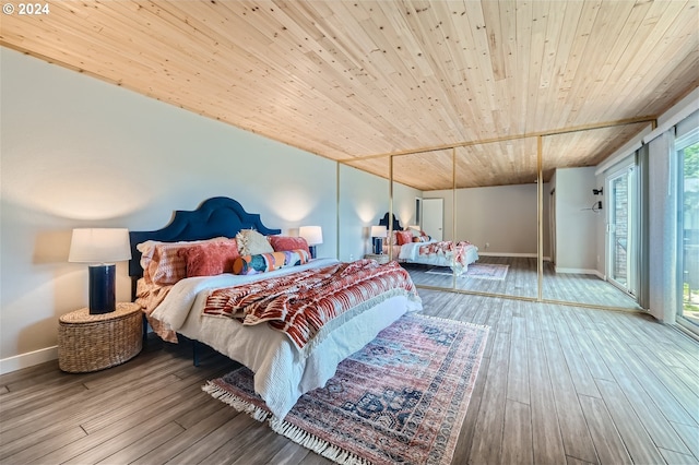 bedroom with access to exterior, wooden ceiling, and hardwood / wood-style flooring