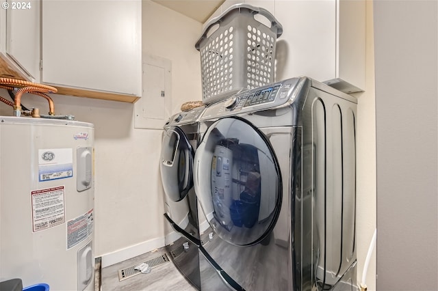 laundry area featuring washer and dryer, wood-type flooring, electric panel, and water heater