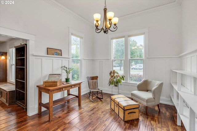 sitting room with an inviting chandelier, a decorative wall, and wainscoting