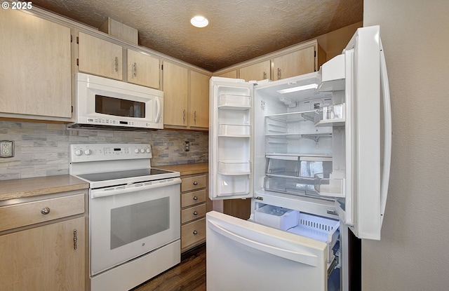 kitchen featuring white appliances, decorative backsplash, dark wood-type flooring, light countertops, and a textured ceiling