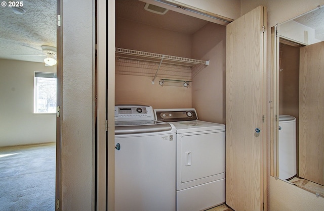 laundry room with laundry area, ceiling fan, light colored carpet, and independent washer and dryer