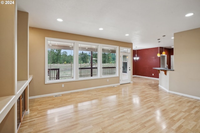 unfurnished living room featuring light wood-type flooring