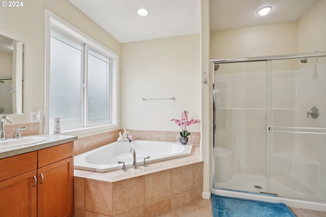 bathroom with vanity, separate shower and tub, tile patterned floors, and plenty of natural light