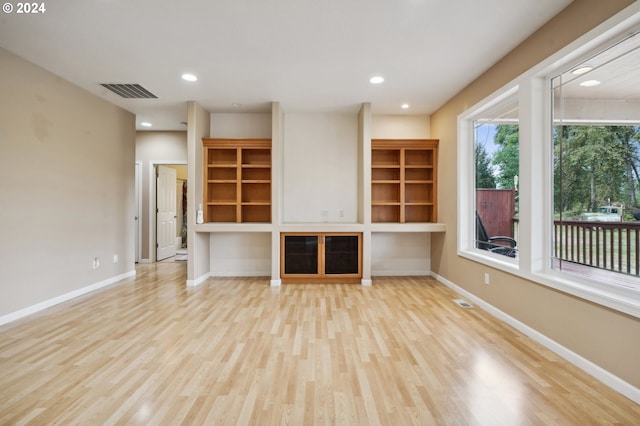 unfurnished living room with light hardwood / wood-style floors