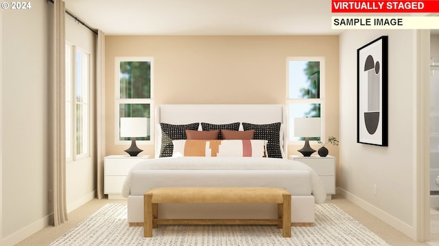 bedroom with light colored carpet