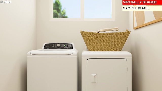 clothes washing area with independent washer and dryer