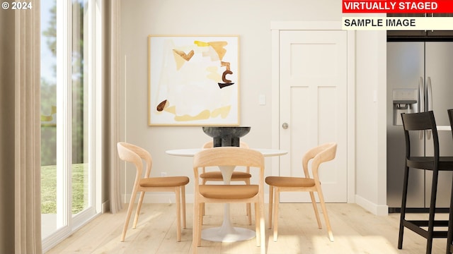 dining room with light hardwood / wood-style flooring