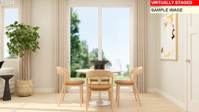 sitting room featuring a wealth of natural light and light hardwood / wood-style floors